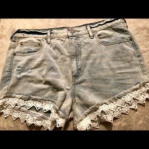 Free People light wash jean shorts with lace
